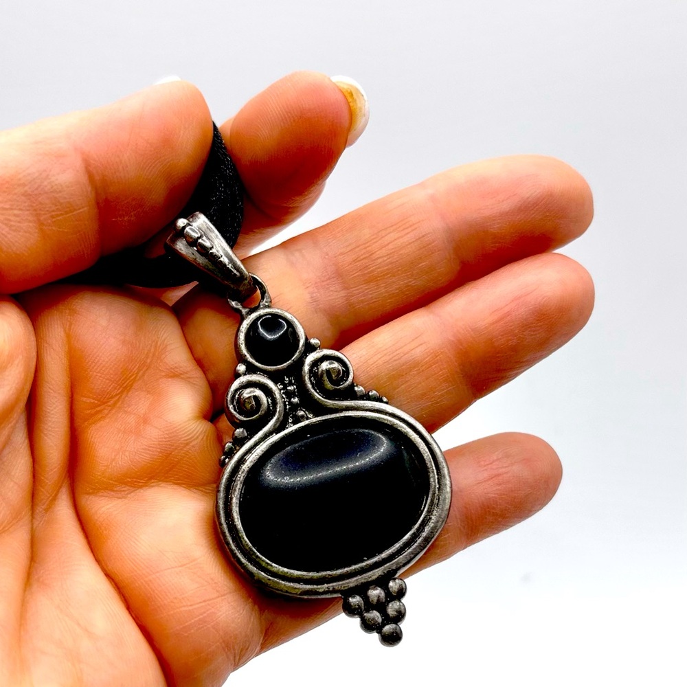 Silver and Black Pendant Necklace. Intricate, hammered design. Corded necklace.